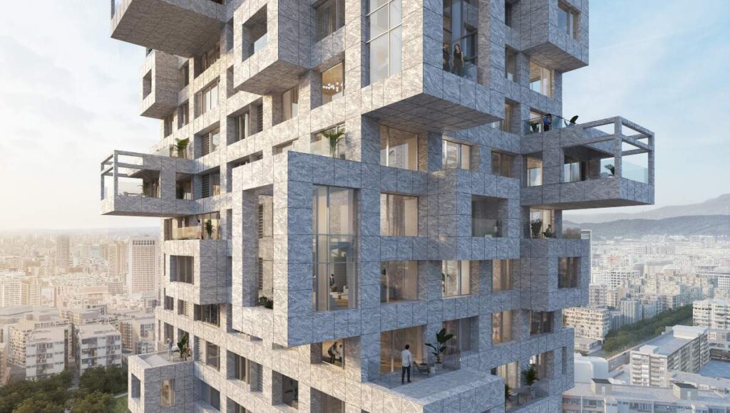 Vista cercana de un exclusivo proyecto residencial de gran altura en Taiwán, diseñado por el reconocido estudio MVRDV. Su imponente fachada geométrica, con volúmenes dinámicos y líneas contemporáneas, resalta en el horizonte urbano. La propiedad ofrece amplios ventanales que favorecen la entrada de luz natural, balcones irregulares con impresionantes vistas panorámicas y terrazas ajardinadas que integran la naturaleza al entorno residencial. Estos detalles arquitectónicos no solo aportan sofisticación y modernidad, sino que también elevan la calidad de vida, convirtiendo este desarrollo en una oportunidad única para inversores y compradores exigentes que buscan exclusividad e innovación inmobiliaria.