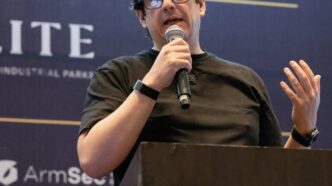 Man speaks at REBS Guadalajara event.