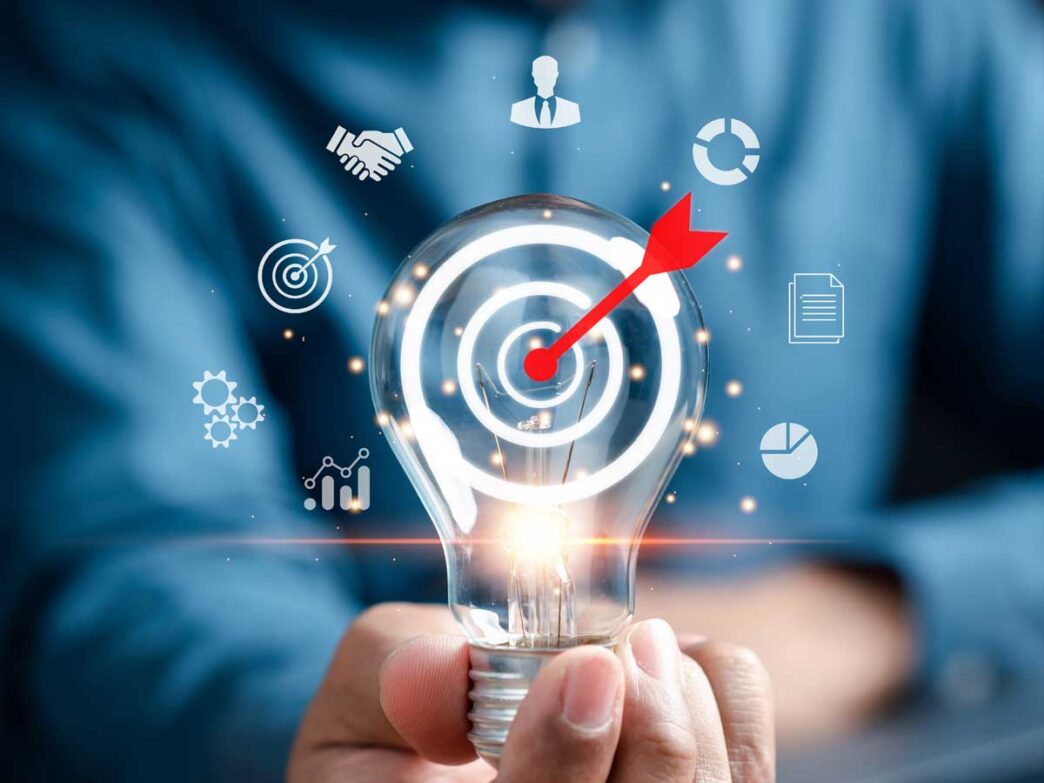 Sponsors/branding.

Foco con diana y flecha, simbolizando el éxito en Inmobiliare Summits. Imagen conceptual para la conferencia de real estate en México, LATAM.