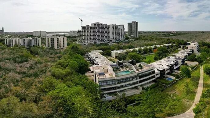 Venue/architecture.

Vista aérea de inmuebles residenciales en ciudad de México. Arquitectura moderna y áreas verdes. Espacios para el sector real estate en Inmobiliare Summits.
