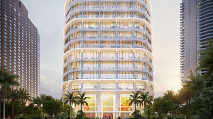Nueva sede de Citadel en 1201 Brickell Bay Drive: Edificio moderno con fachada de cristal, palmeras y cielo al atardecer. Arquitectura vanguardista.