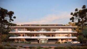 Arquitectura de The Edge en Uruguay por Foster + Partners: Edificio moderno de tres pisos con amplios balcones y diseño vanguardista en entorno natural.