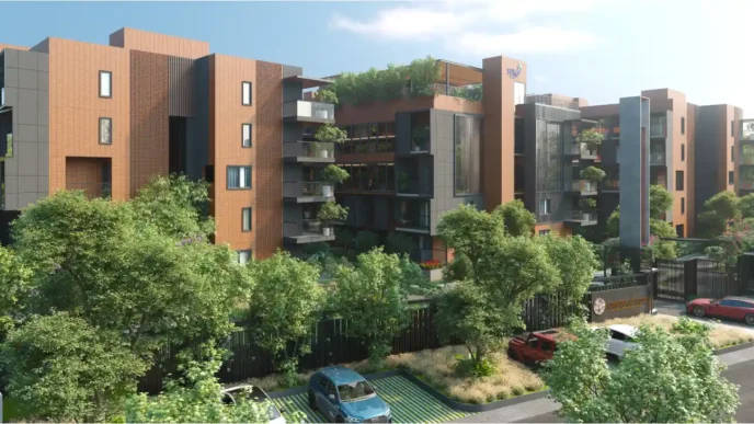 Edificio residencial de alta gama en Bengaluru, que muestra innovación y sostenibilidad en Real Estate. Arquitectura moderna integrada con vegetación exuberante.