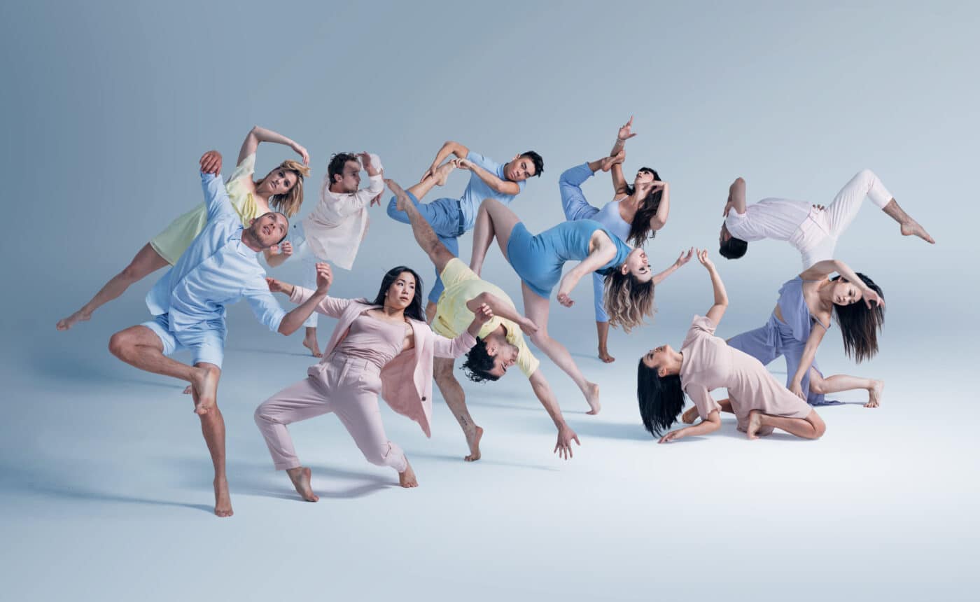 The image does not fit any of the categories provided.

Here's the alt text:

Grupo de bailarines en movimiento coordinado. Diseño y arte del Museo Yancuic en México. Bienal Mexicana.