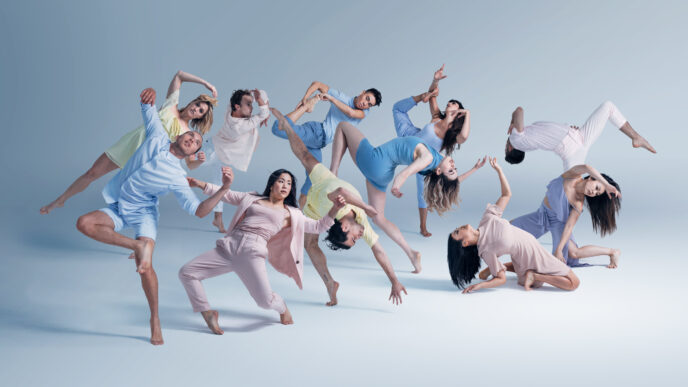 The image does not fit any of the categories provided.

Here's the alt text:

Grupo de bailarines en movimiento coordinado. Diseño y arte del Museo Yancuic en México. Bienal Mexicana.