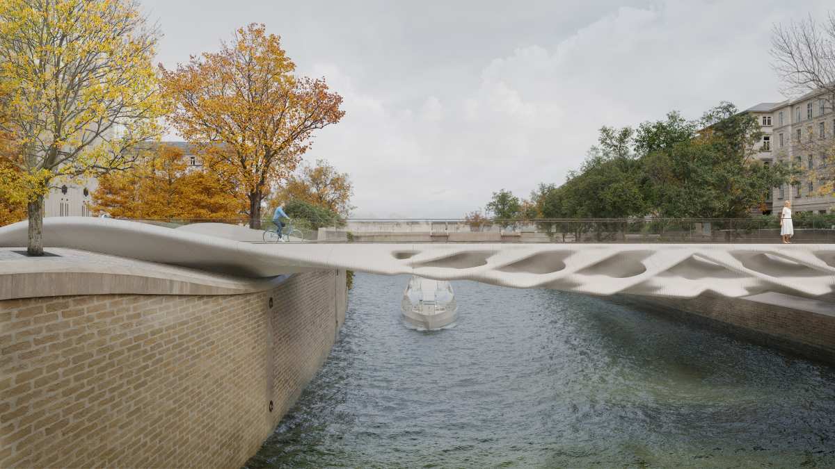 Classification: venue/architecture
Puente peatonal moderno sobre río. Diseño innovador con aberturas y sombras. Arquitectura urbana, ciudad.