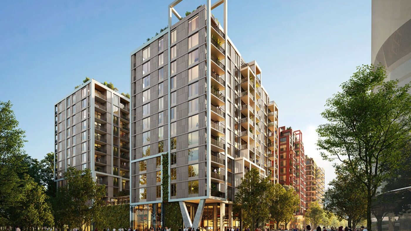 Vista de edificios multifamiliares modernos con balcones y áreas verdes. Diseño sostenible, innovación en renovaciones multifamiliares, valor duradero.