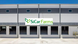 Centro clave de SiCar Farms en Florida para cítricos: fachada del almacén con el logo de la empresa, enfocado en productos frescos. Inauguración.