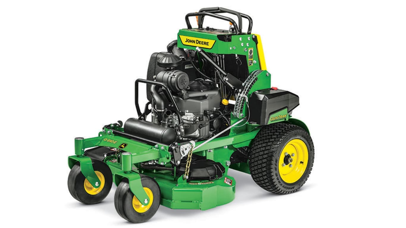 Primer plano de cortacésped John Deere, verde y amarillo. Tecnología de camiones limpios para impulso verde en real estate.
